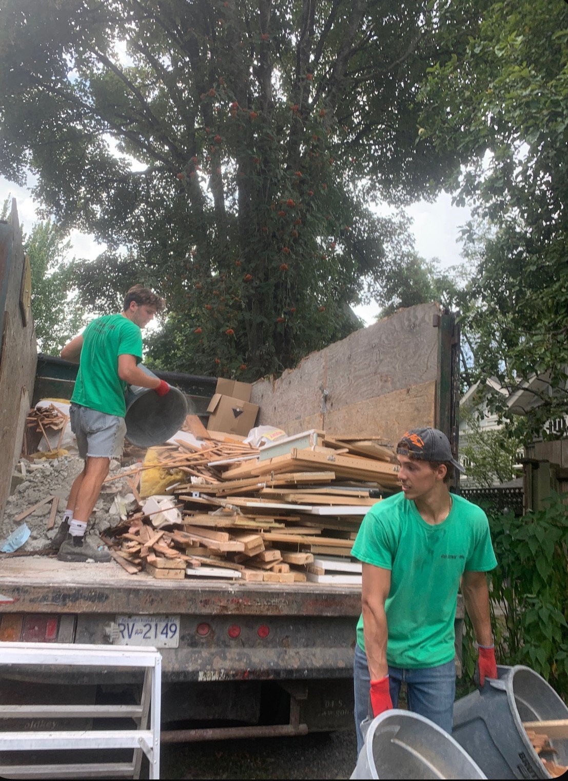 Go Junk Go team loading construction debris and junk onto truck in Vancouver