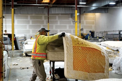 Professional mattress recycling facility processing old mattresses in Vancouver