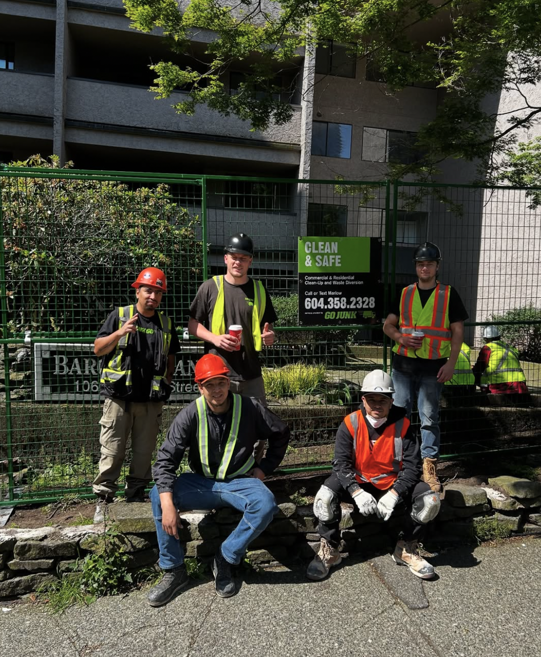 Go Junk Go crew on commercial demolition site in Vancouver - professional team with safety equipment